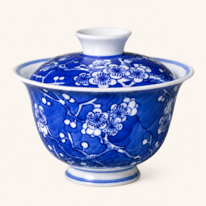 Blue-and-white ice-plum gaiwan, white prunus reserved on cobalt ground, Jingdezhen