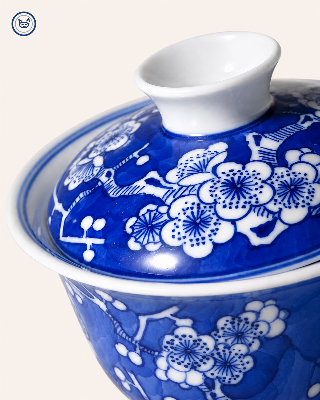 Blue-and-white ice-plum gaiwan, white prunus reserved on cobalt ground, Jingdezhen