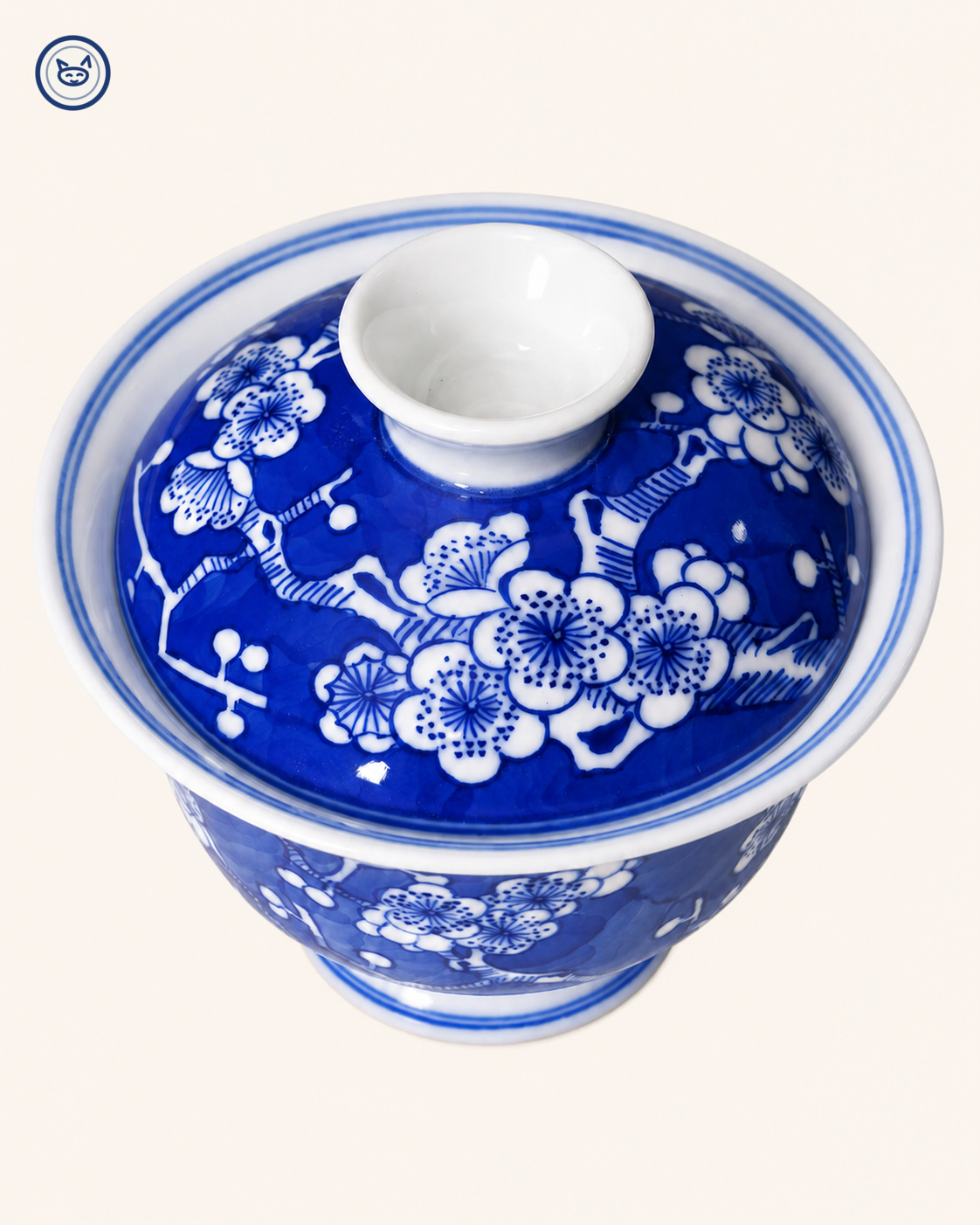 Blue-and-white ice-plum gaiwan, white prunus reserved on cobalt ground, Jingdezhen